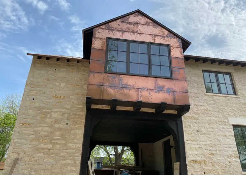 Copper metal panel facade on a stone building for Metal Roof Coating in Canyon