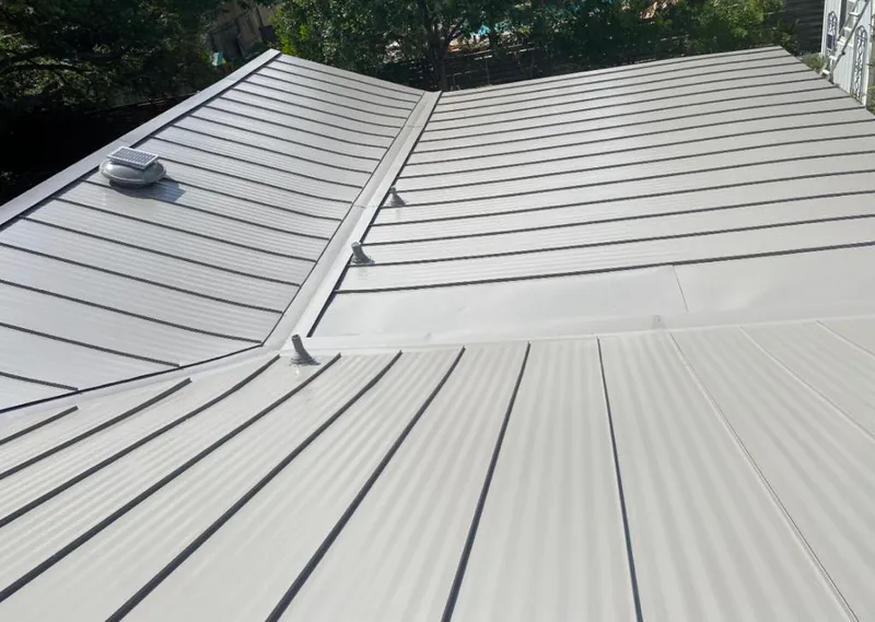 Solar attic fan installed on a metal roof for Roof Ventilation in Canyon